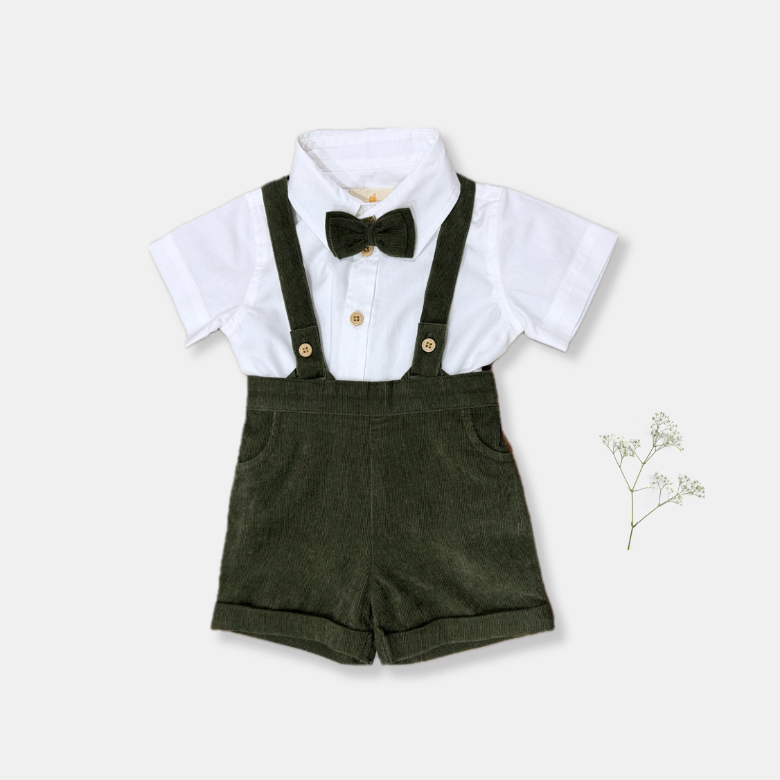 Baby boys birthday outfit in jungle green. White shirt, green shorts and bowtie. Organic Cotton sustainable